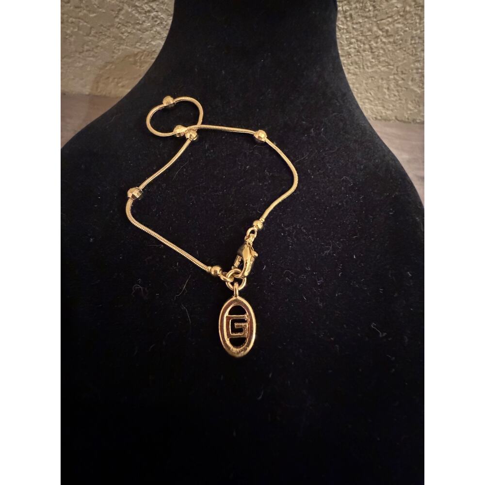 Vintage Givenchy Gold Tone G Logo Charm Bracelet Greek Key Logo 7"